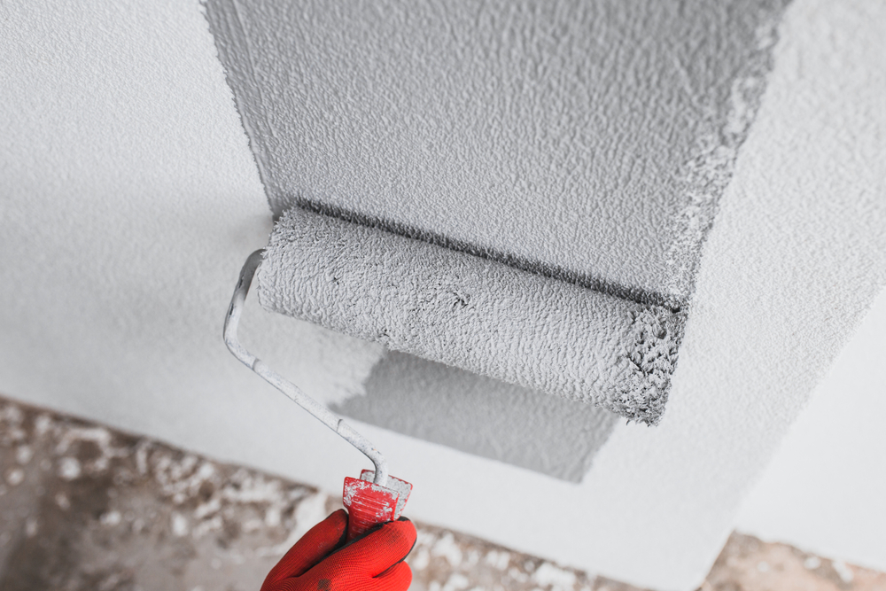 The,Painter,Paints,The,Outer,Wall,Of,The,Building,With